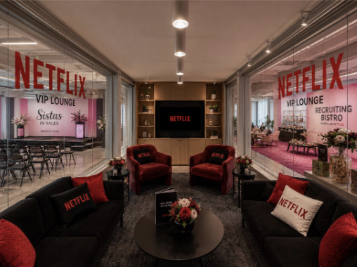The Netflix VIP Lounge at SIS Summit, with Netflix branding and private seating