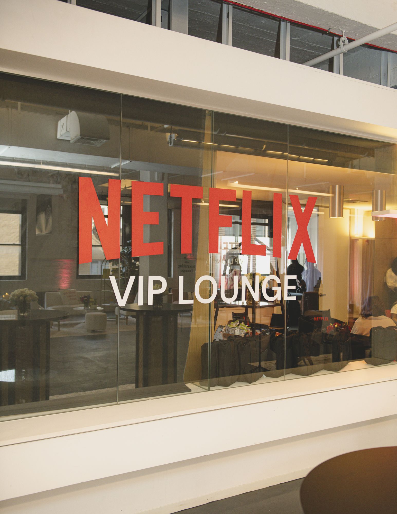 Netflix VIP Lounge lettering on a glass wall