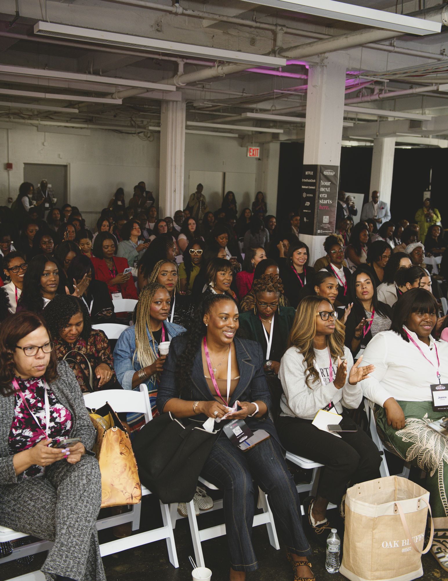 Full audience seated facing the stage at the 2026 SIS Summit