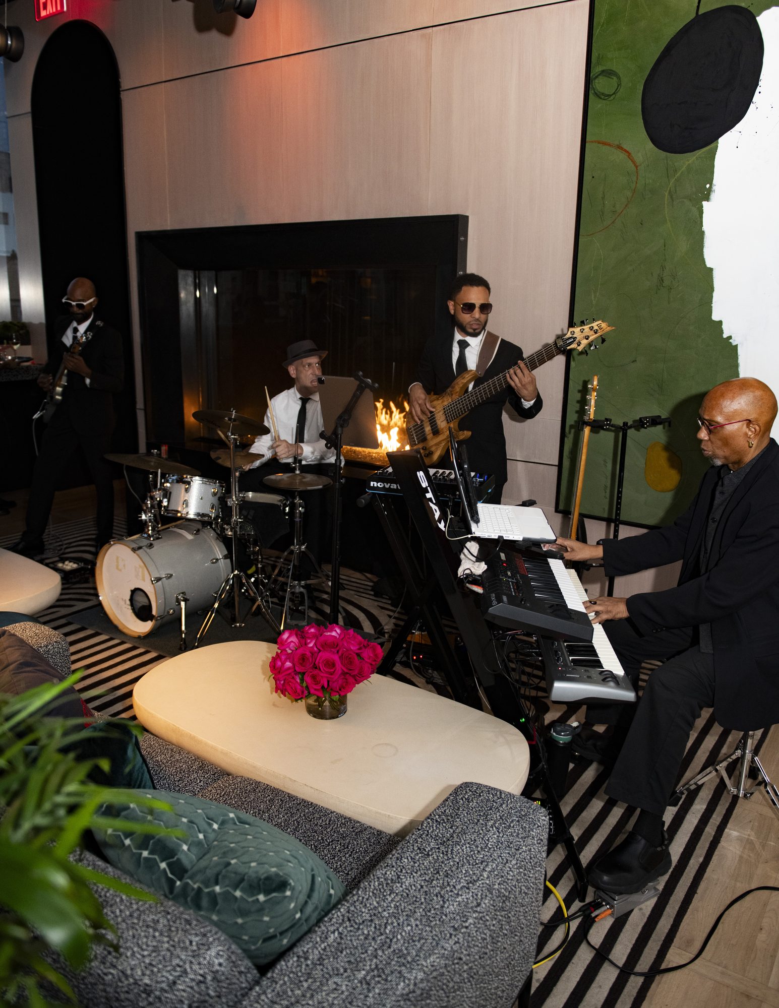 Live band performing by the fireplace