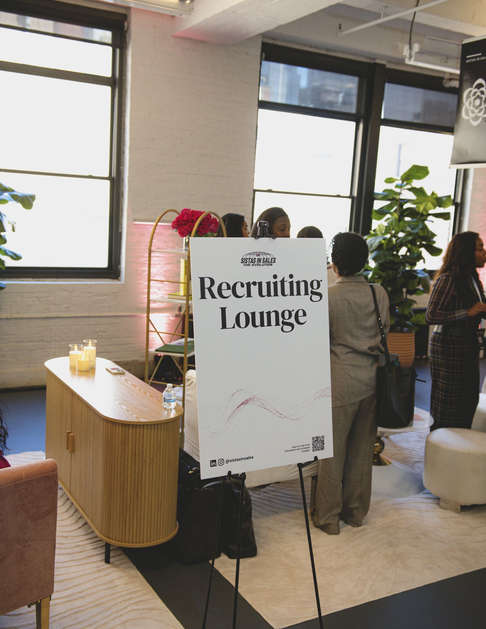 Recruiting Lounge sign with attendees in conversation