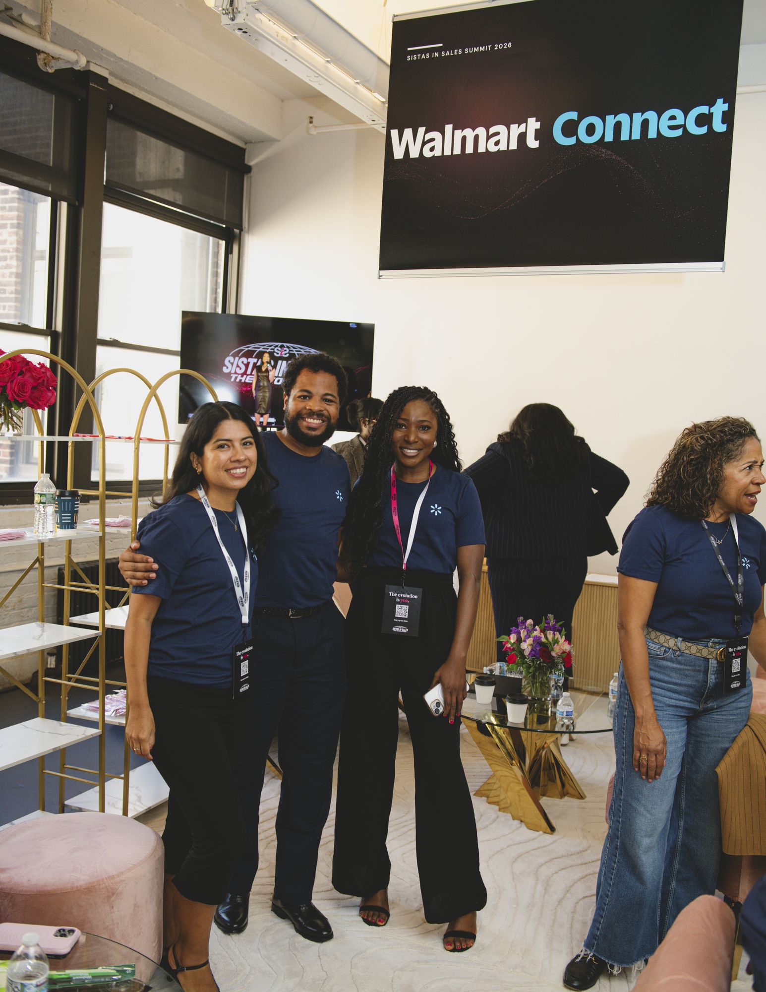 Walmart Connect team and attendees talking in the partner space