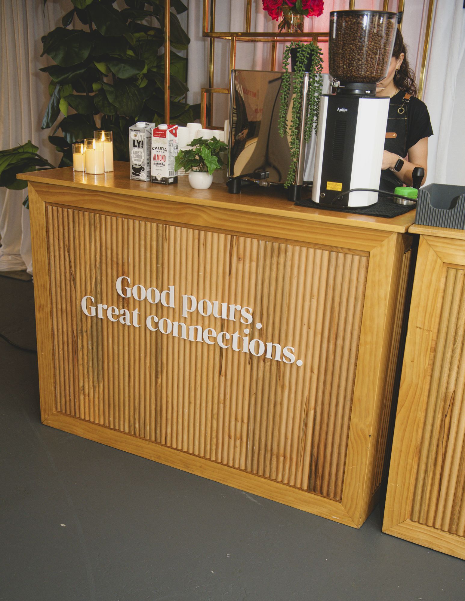 Bar with a sign reading Good pours. Great connections.