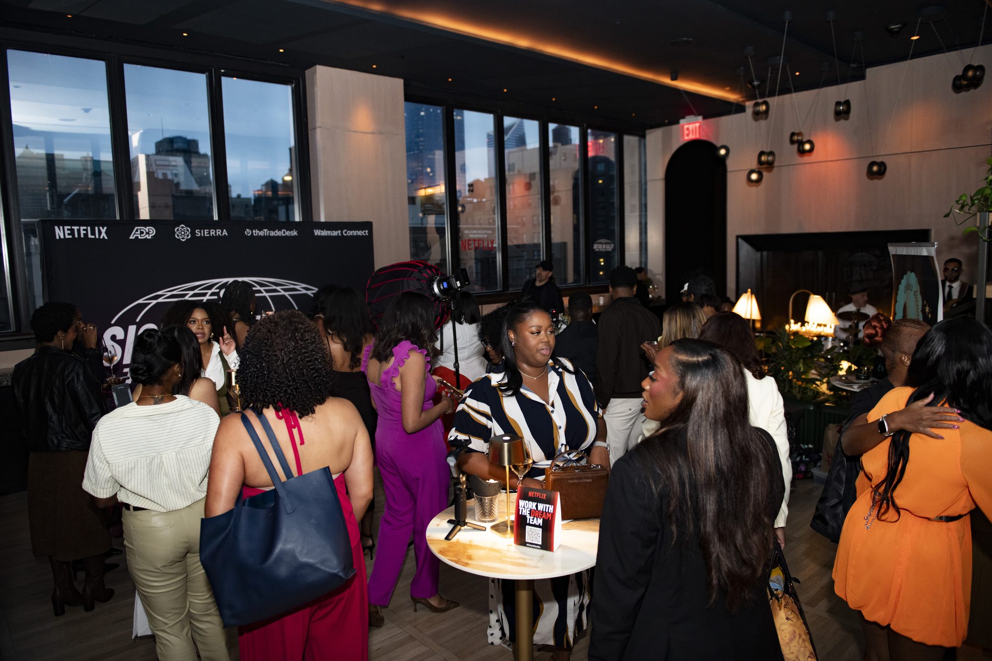 Crowd of guests mingling inside the reception venue