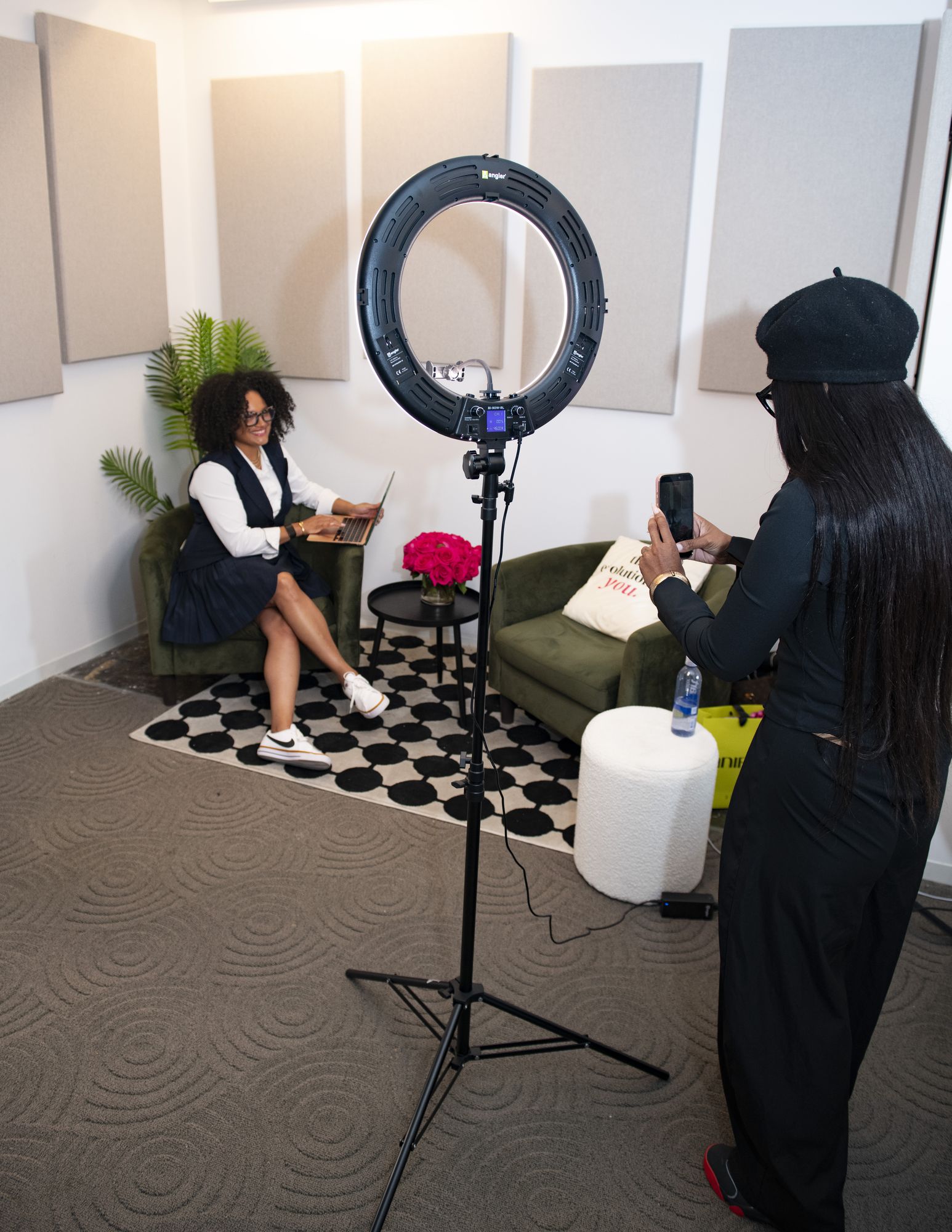 Attendee filming content under a ring light in the SIS Content Studio