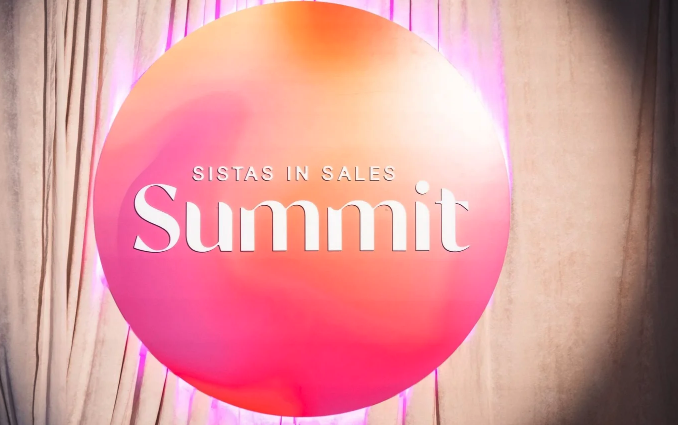 Sistas in Sales Summit pink photo moment backdrop