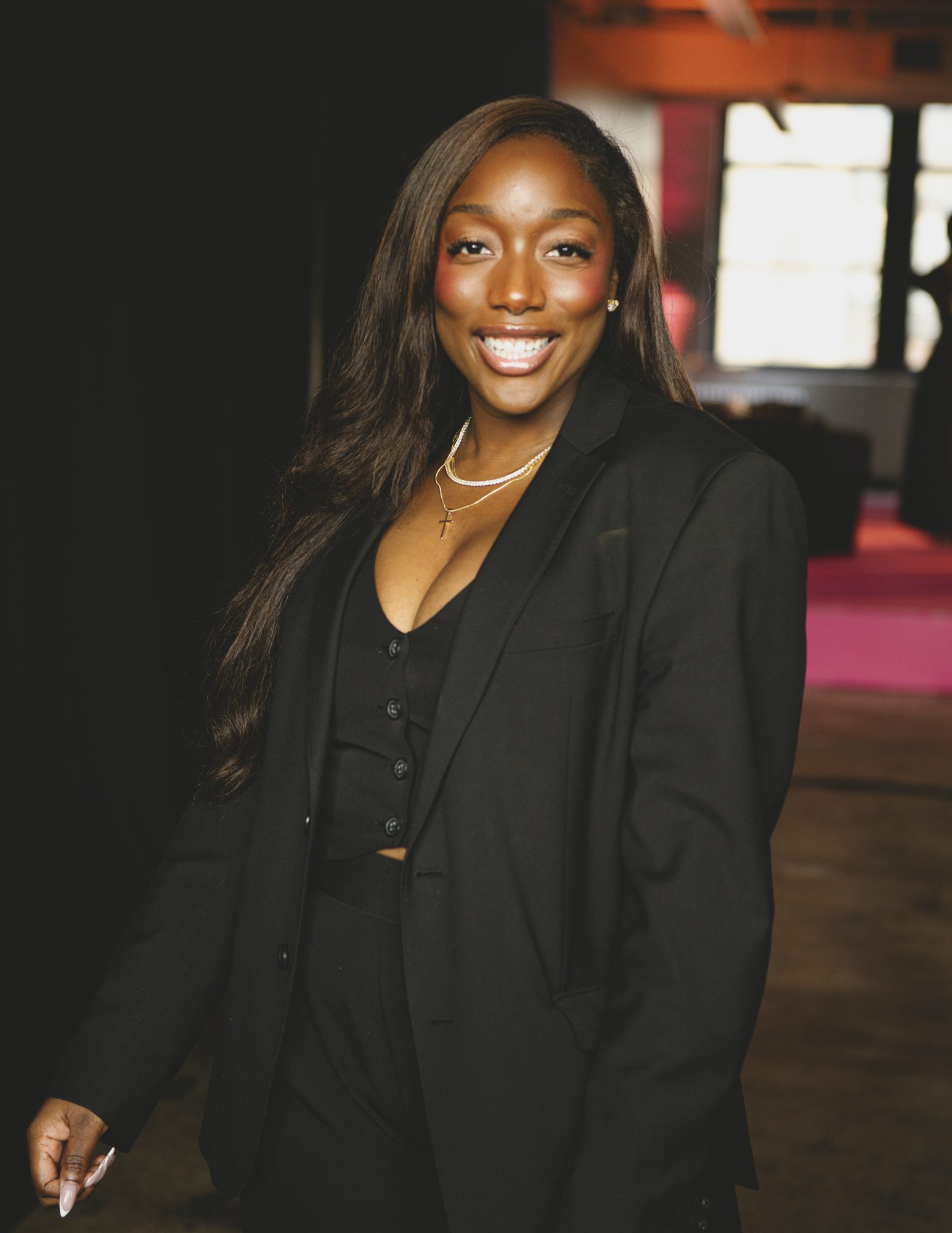 Portrait of a smiling woman in a black suit